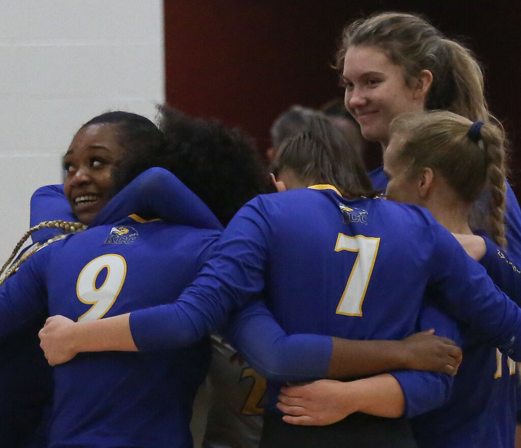 The Kansas Christian College volleyball team embraces
